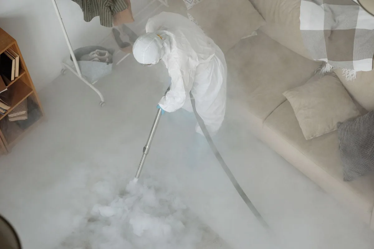Biohazard cleanup technician in protective equipment, Emerson, GA